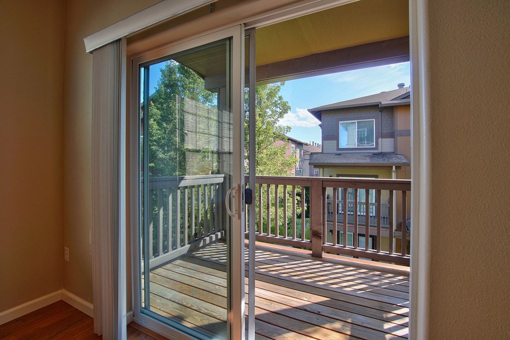 a view of the deck through a sliding glass door