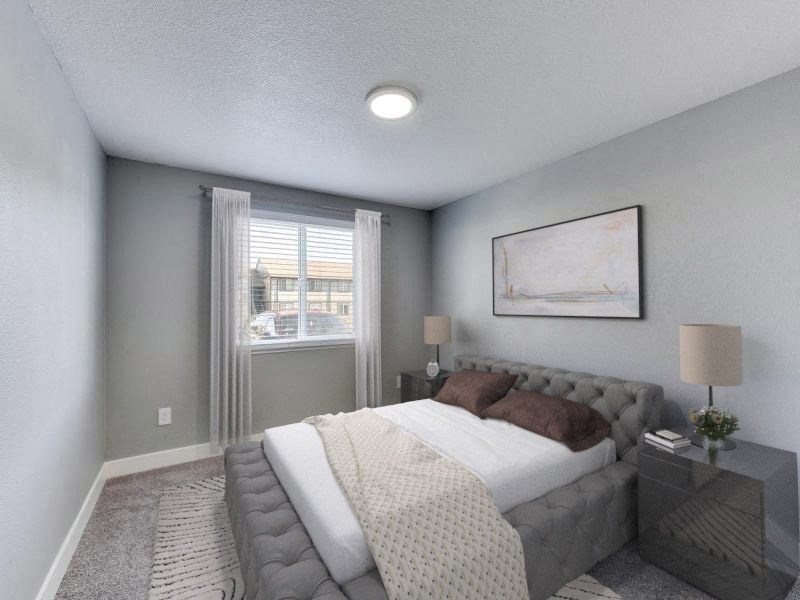 an empty bedroom with a bed and a window