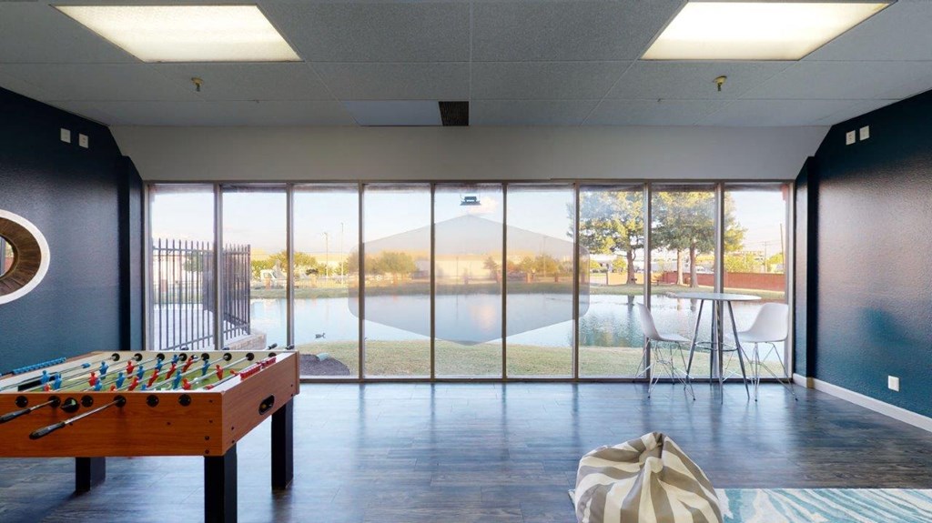 The Annex Clubhouse Lounge with Games and View of Pond