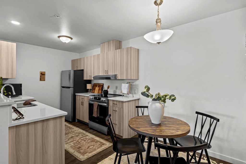 The Banks on Bradley Apartments in Richland, Washington Model Kitchen and Dining Area