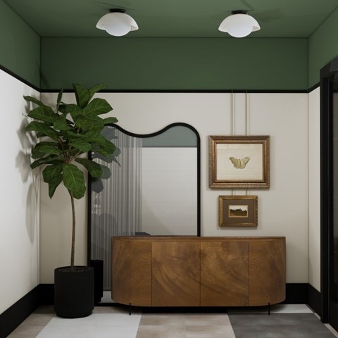 A room with a wooden cabinet and a potted plant.