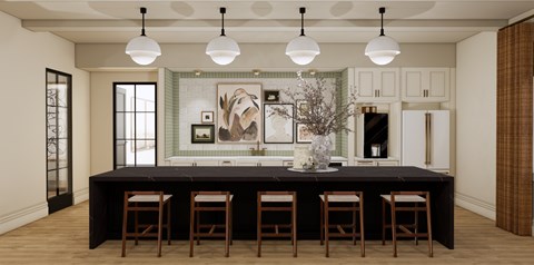A kitchen with a black table and chairs.