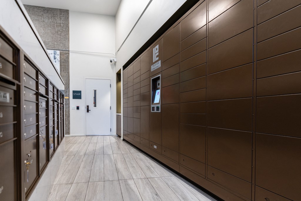 a row of brown lockers in a hallway of a building