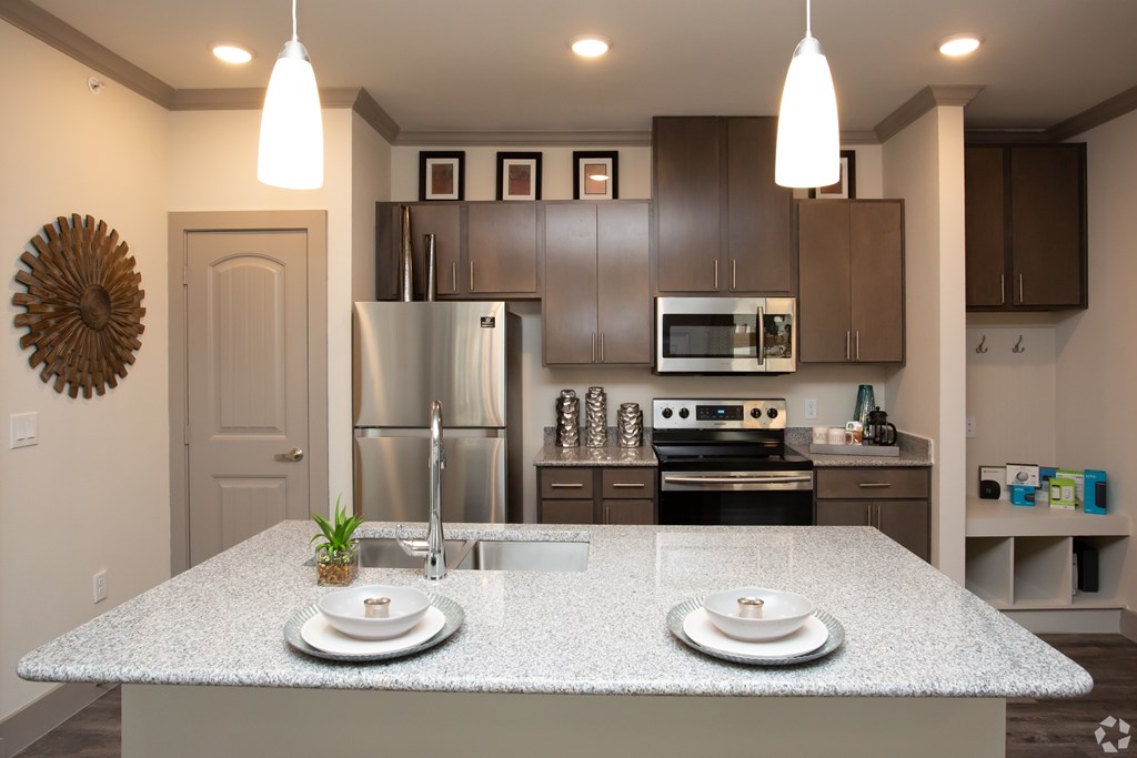 The Flats at Shadowglen Apartments in Manor, TX Model Kitchen