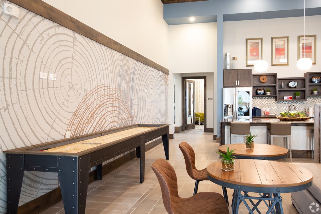 The Flats at Shadowglen Apartments in Manor, TX Clubhouse Lounge with Games