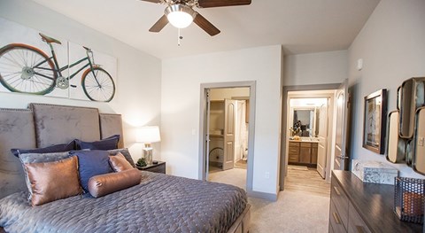 The Flats at Shadowglen Apartments in Manor, TX Model Bedroom with Attached Bathroom
