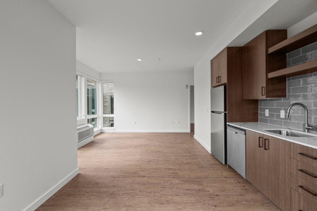 a kitchen with a sink and a refrigerator