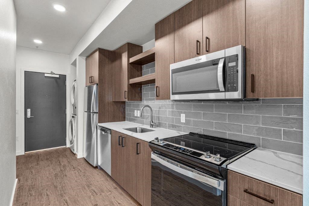 a kitchen with a stove and a microwave