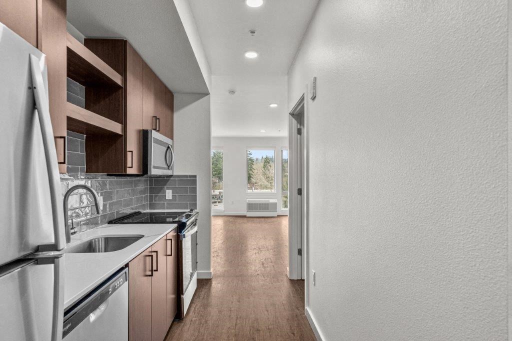 a kitchen with a sink and a refrigerator