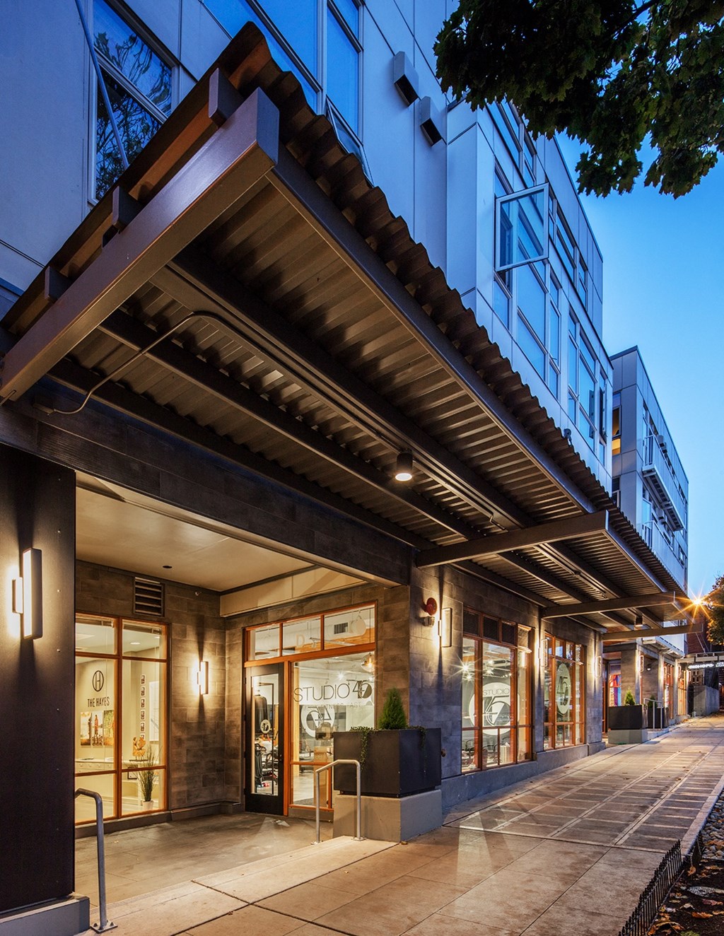 a view of the front of a building at night