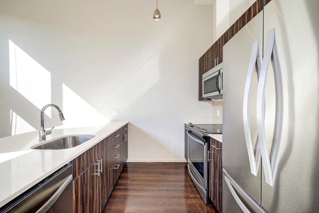 a kitchen with stainless steel appliances and a sink