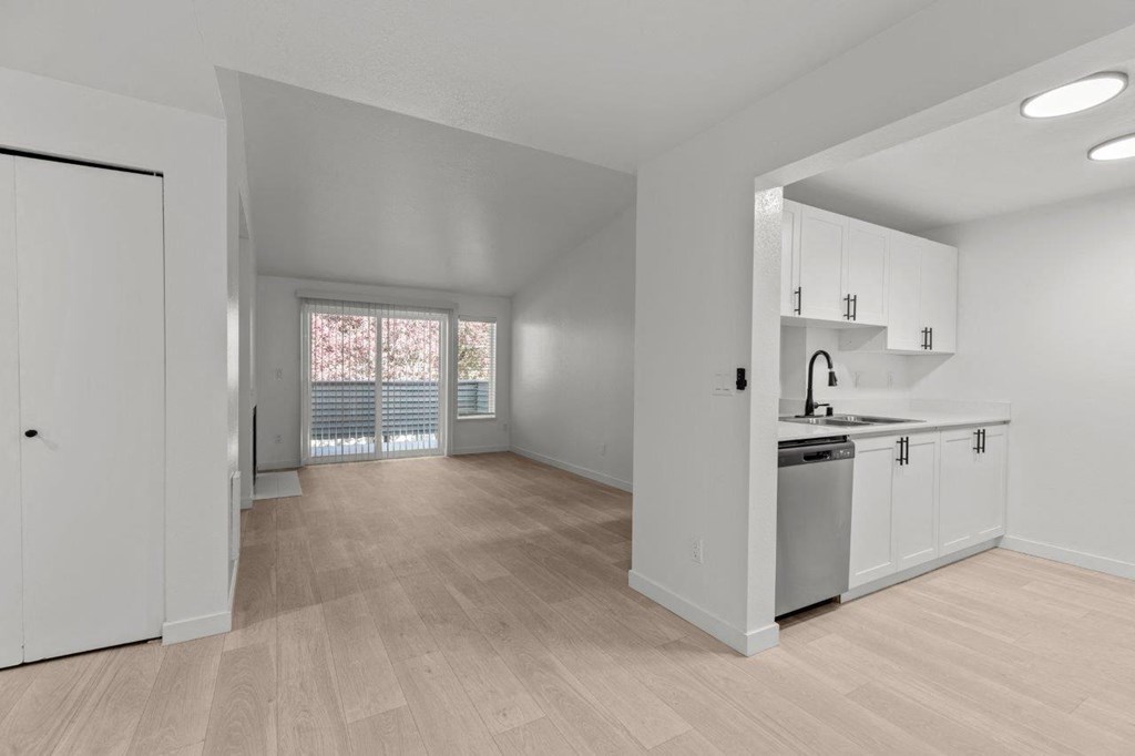 The Marina at Martha Lake Apartments in Bothell, WA Kitchen and View into Living Room