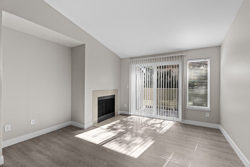 The Marina at Martha Lake Apartments in Bothell, WA Living Room with Fireplace and Private Patio