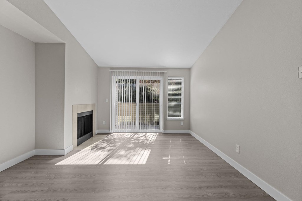 The Marina at Martha Lake Apartments in Bothell, WA Living Room with Fireplace and Private Patio