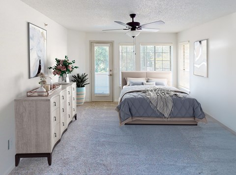 A bedroom with a bed, dresser, and a ceiling fan.