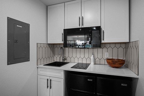 a kitchen with a sink and a microwave