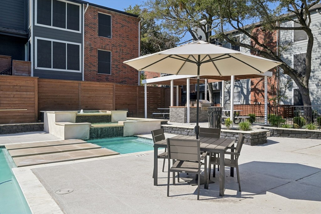The Monet Apartments in Dallas, Texas Pool and Patio with Seating