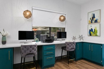 The Montana Apartments Business Center with Computers and Desk Chairs - Photo Gallery 4