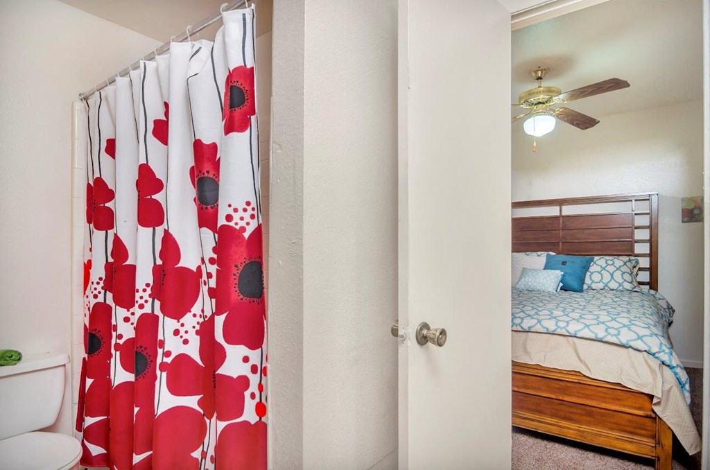 The Patrick Apartments in Stephenville, Texas Model Bathroom and View into Bedroom