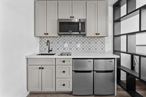 a kitchen with a sink and a microwave