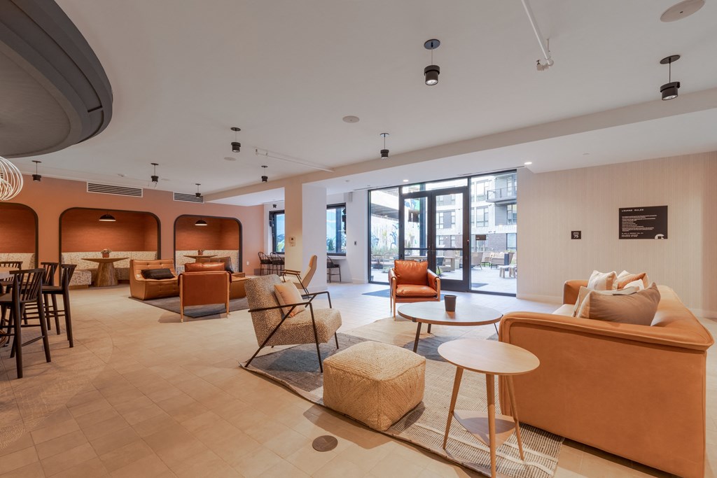 A living room with orange walls and furniture.