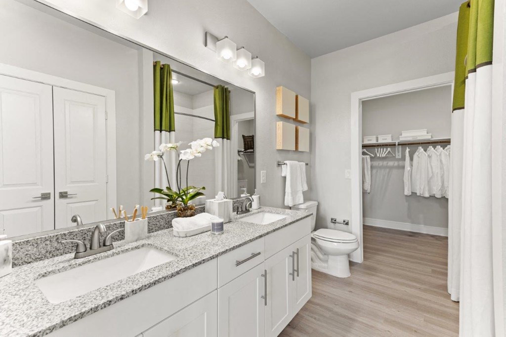 The Southbrook Apartments in Leander, Texas Model Bathroom with Double Vanities and Attached Walk-In Closet
