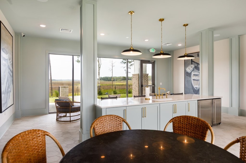 A modern dining room with a table and chairs.