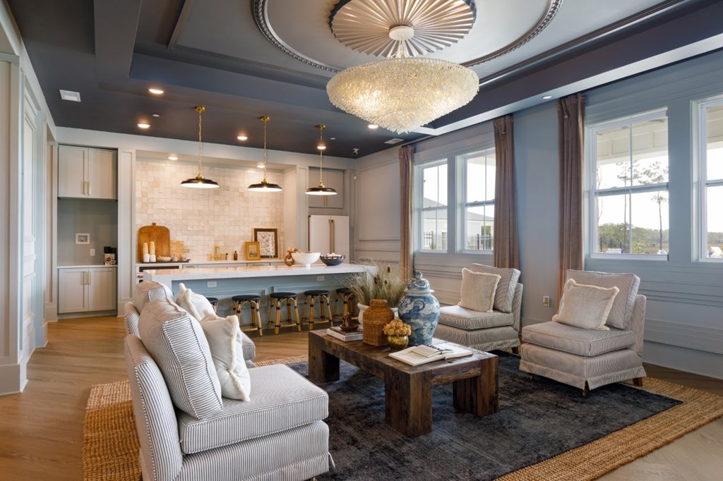 A modern living room with a grey sofa and a wooden coffee table.