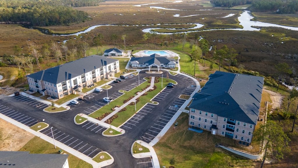 A parking lot with a building in the background.