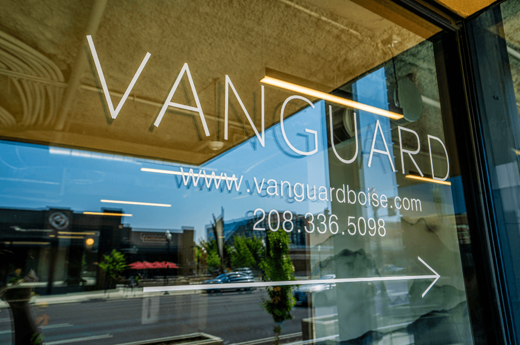 the logo is displayed on the window of a store