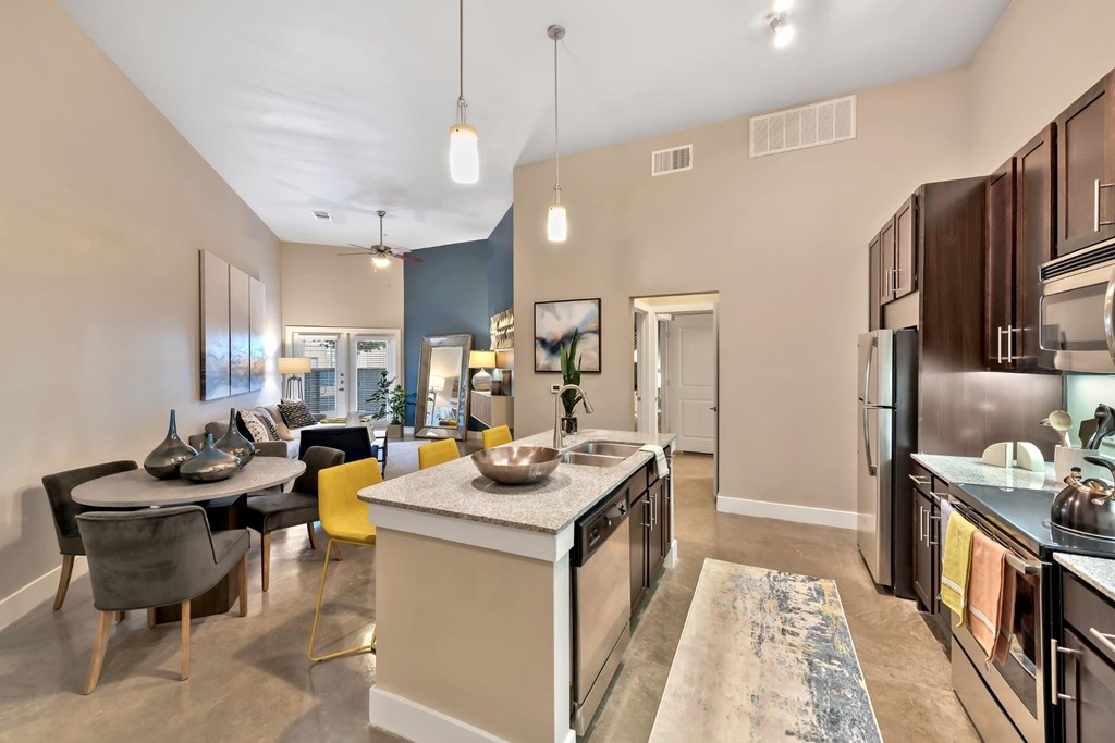 The Wall Street Lofts in Midland, Texas Model Kitchen with Island and Dining Area