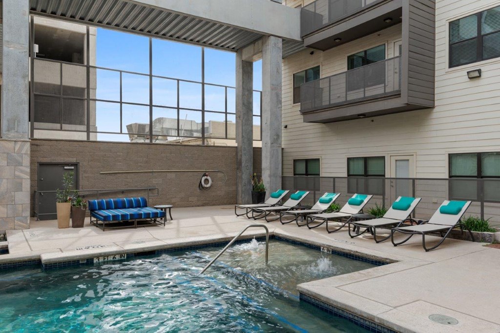 The Wall Street Lofts in Midland, Texas Pool with Lounge Chairs