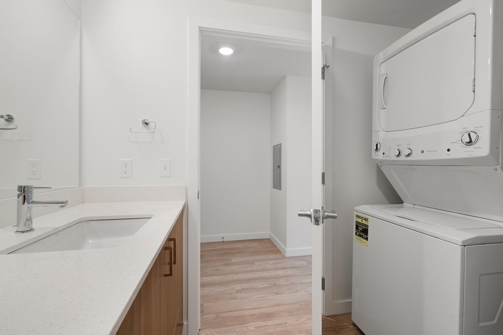The Warren Apartments bathroom with washer and dryer