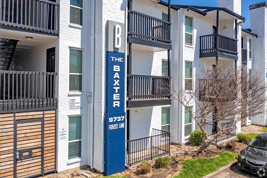 the baxter apartments exterior with signage
