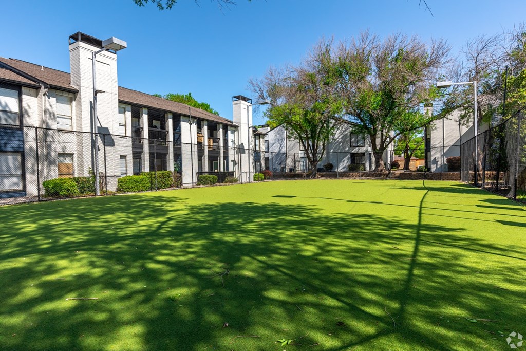 a green lawn in front of The Beckham Apartments