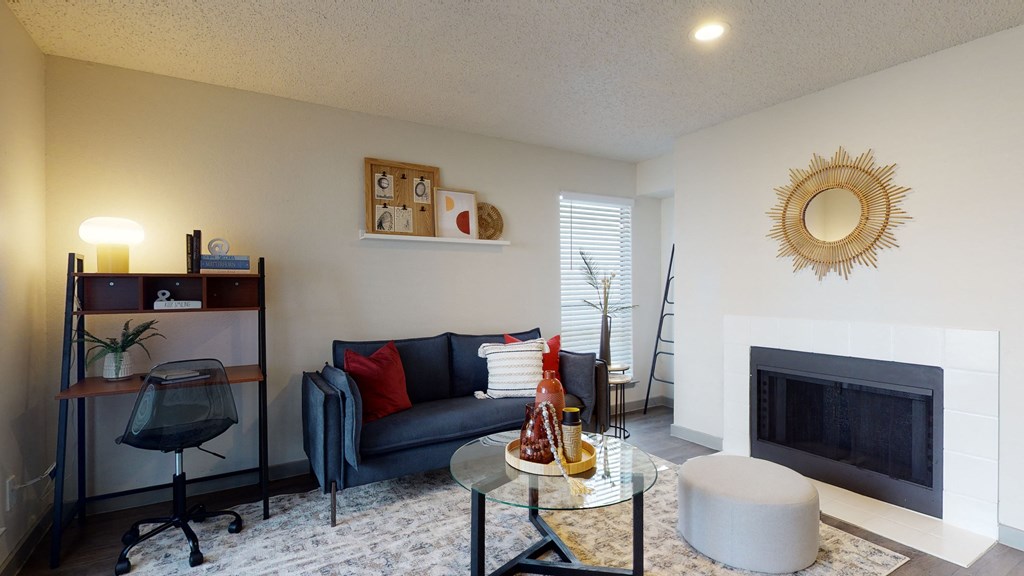 a living room with a couch and a fireplace