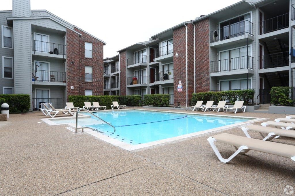 a swimming pool in the middle of an apartment building