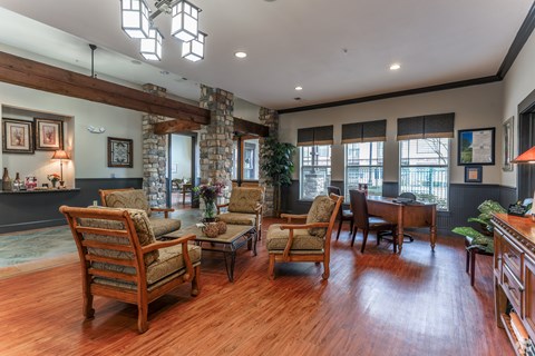 A living room with wooden floors and furniture.