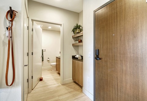a hallway with wooden floors and a wooden door