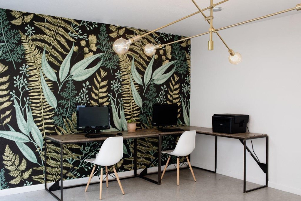 a home office with a wall mural