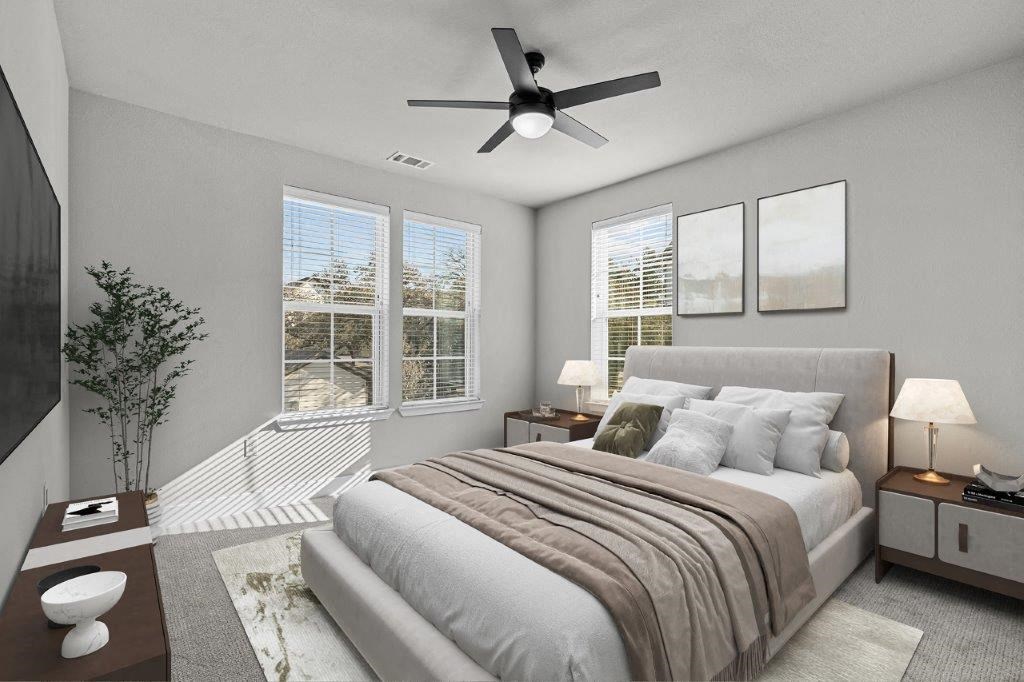 a bedroom with a large bed and a ceiling fan at Lenox Grand, Austin, 78727
