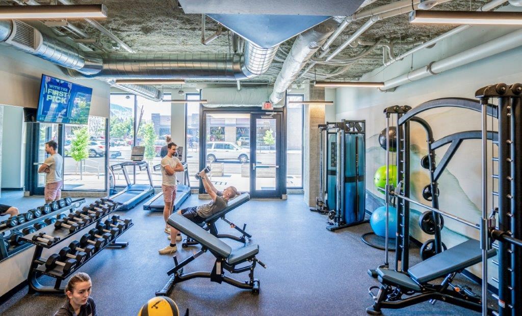 a group of people working out in a gym