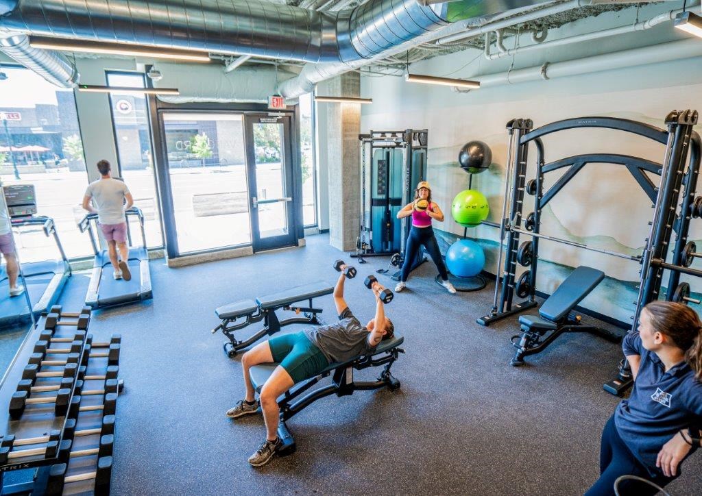 a group of people working out in a gym