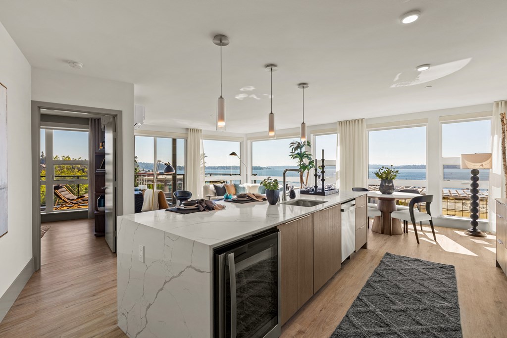 Vela Apartments kitchen and living room with a view of the water