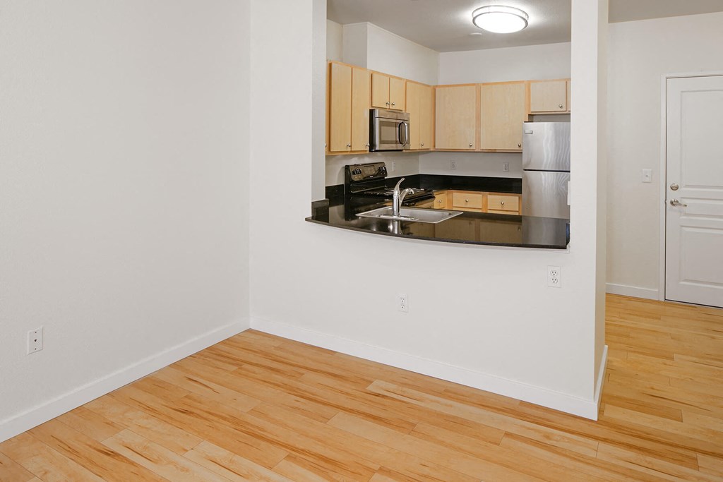 Collins Circle Apartment view of a kitchen with wood flooring and