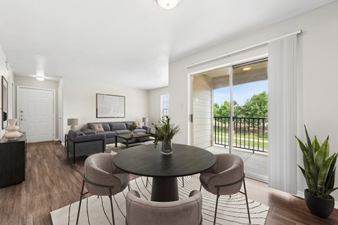 A modern living room with a grey sofa and a round table.