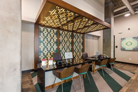 A conference room with a long table and chairs.