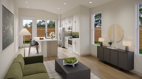 A modern living room with a green sofa and a coffee table in the center.