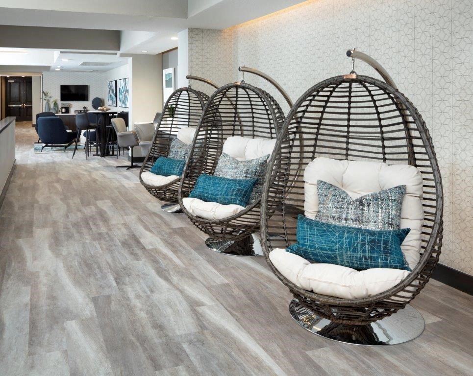 a group of chairs sitting on top of a hard wood floor