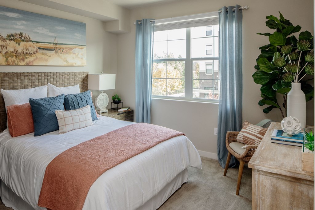 WestEndDistrict_Beaverton_OR_photos_bedroom with a large bed and a desk with a chair